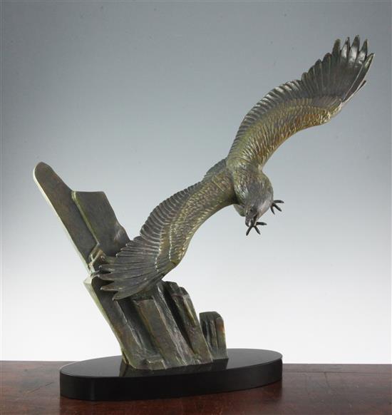 A French Art Deco patinated metal model of an eagle in flight, 23.5in.